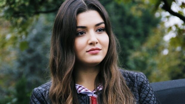 A close up of Hande Ercel standing outdoors with trees in the background, HD Desktop Wallpaper