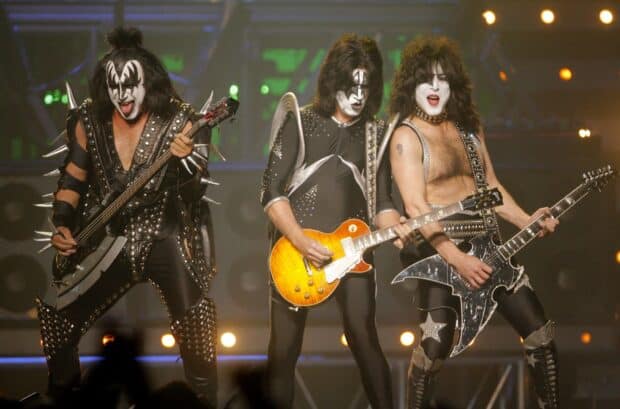 Three musicians play guitars with face paint and costumes, HD Desktop Wallpaper