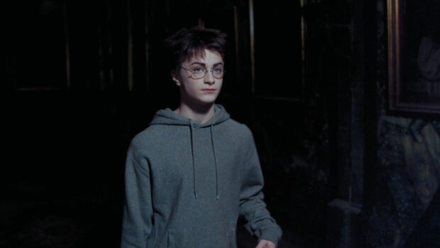 Harry Potter stands in a dark room wearing a grey hoodie in The Prisoner Of Azkaban Wallpapers, HD Desktop Wallpaper