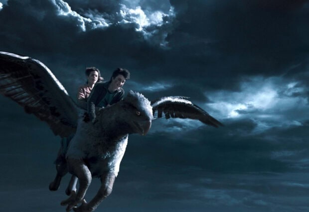 Harry and Hermione fly on a hippogriff through dark clouds at night, HD Desktop Wallpaper