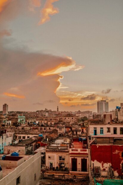The Havana Cuba Wallpapers cityscape shows colorful buildings under a glowing sunset sky, HD Phone Wallpaper