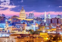 The Havana city skyline shows historic buildings and vibrant colors during sunset, 2K Desktop Wallpaper