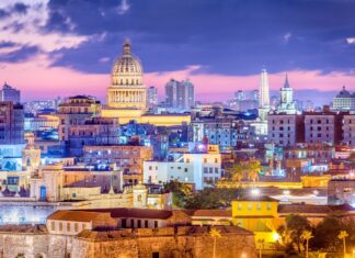 The Havana city skyline shows historic buildings and vibrant colors during sunset, 2K Desktop Wallpaper
