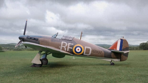 A Hawker Hurricane fighter aircraft is parked on grassy field with a cloudy sky, HD Desktop Wallpaper