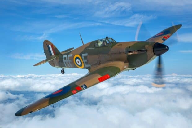 A hawker hurricane flies above white clouds on a clear blue sky, HD Desktop Wallpaper