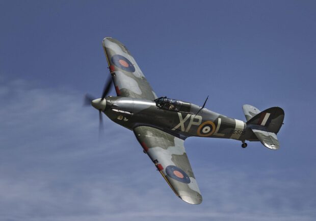 A Hawker Hurricane fighter plane flies against a blue sky, HD Desktop Wallpaper