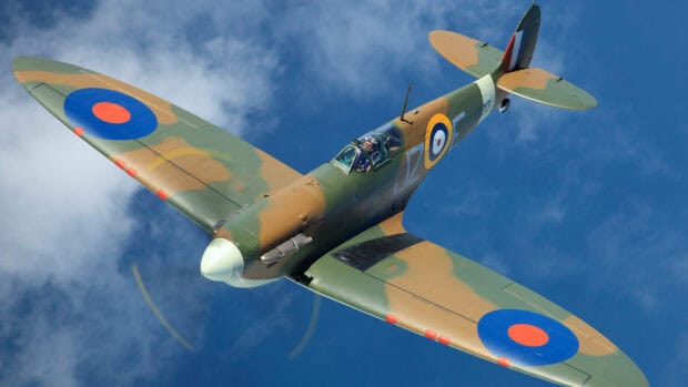 A Hawker Hurricane aircraft flies against a blue sky with distinctive roundel markings, HD Desktop Wallpaper