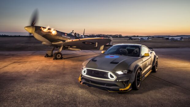 A Hawker Hurricane aircraft is parked next to a modern car at an airfield during sunset, 2K Desktop Wallpaper