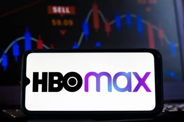 The HBO max logo is shown clearly on a smartphone screen with a financial chart in the background, 2K Mobile Wallpaper