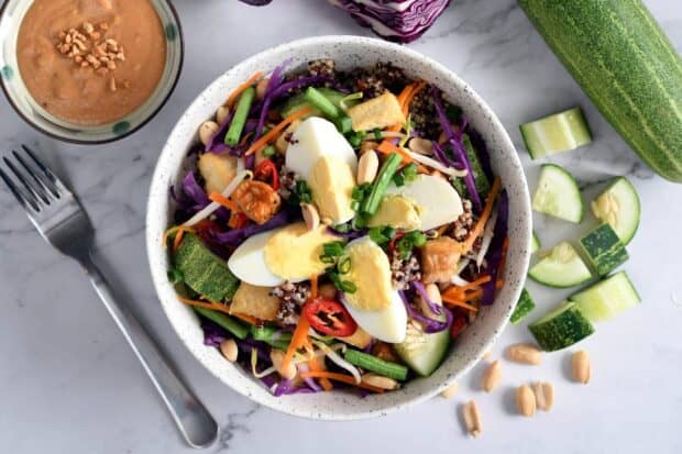 A nutritious quinoa bowl with boiled eggs and fresh vegetables on a table, HD Desktop Wallpaper
