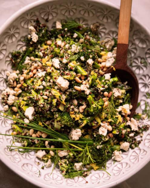A fresh quinoa salad mixed with herbs, nuts, and vegetables on a plate, HD Mobile Wallpaper