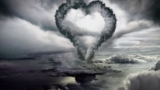 A heart shape formed by smoke clouds in a dramatic sky scene, 4K Desktop Wallpaper