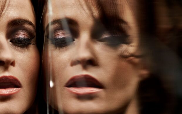 Helena Bonham Carter's thoughtful face reflected in a glass, 2K Desktop Wallpaper