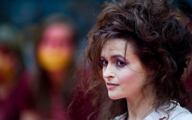 Helena Bonham Carter looks thoughtful with dramatic makeup and wild hair, 2K Desktop Wallpaper