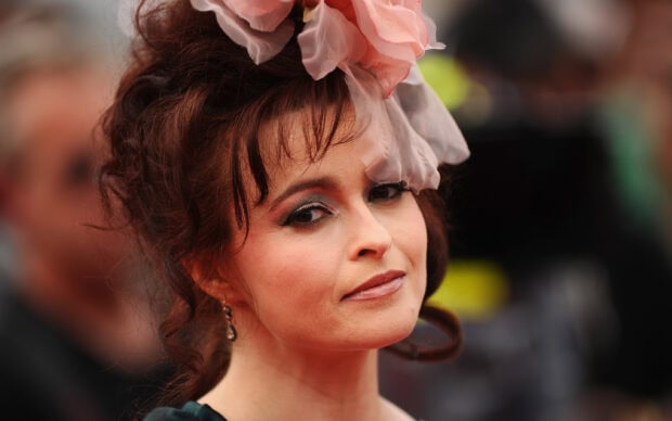 Helena Bonham Carter wears a floral headpiece with elegant makeup in a close up portrait, 2K Desktop Wallpaper