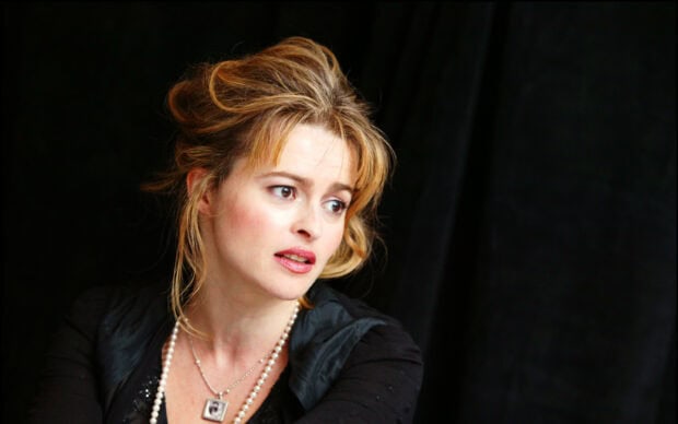 Helena Bonham Carter looks thoughtful with styled hair and pearl necklace, 2K Desktop Wallpaper
