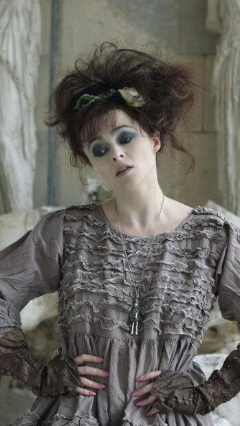 Helena Bonham Carter wears a textured vintage dress in a rustic setting, HD Phone Wallpaper