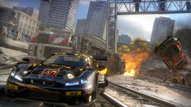 A racing game shows a black and yellow sports car speeding near burning wreckage in a city, HD Desktop Wallpaper