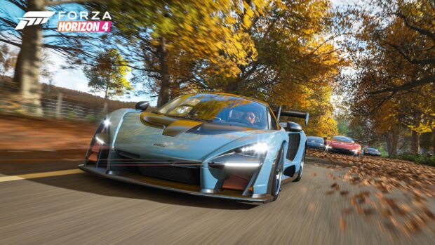 A blue sports car races on an autumn road with colorful leaves and other cars behind it, 4K Desktop Wallpaper