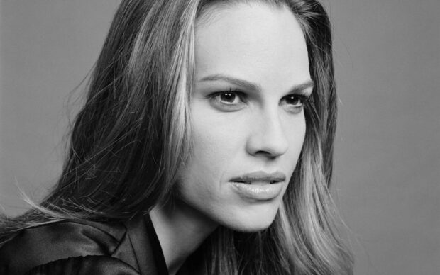 A close up portrait of Hilary Swank showing her serious expression, 2K Desktop Wallpaper