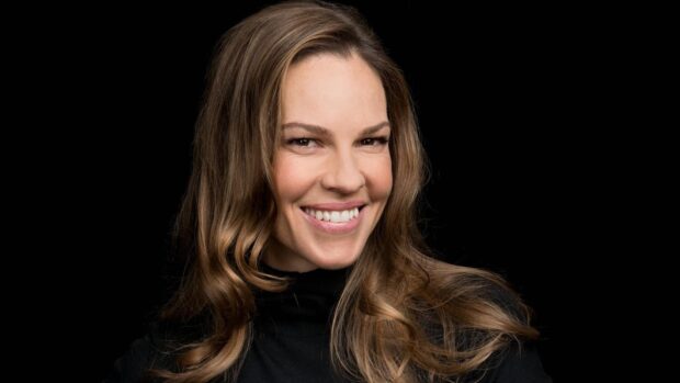 Hilary Swank wallpapers showing a close up of her smiling face with wavy hair, HD Desktop Wallpaper