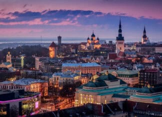 The Estonia Wallpapers show a vibrant city under a colorful sky, HD Desktop Wallpaper