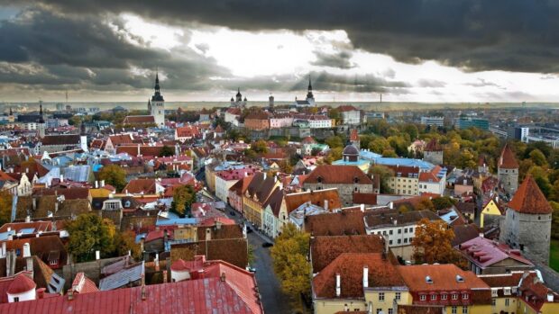 The Estonia cityscape displays autumn colors under a cloudy sky, HD Desktop Wallpaper