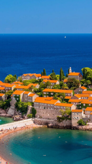 A scenic view of a historic coastal town with orange rooftops and blue sea in Montenegro, HD Mobile Wallpaper