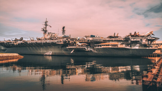 The large naval ship is docked at the maritime museum reflecting on calm water, 4K Desktop Wallpaper