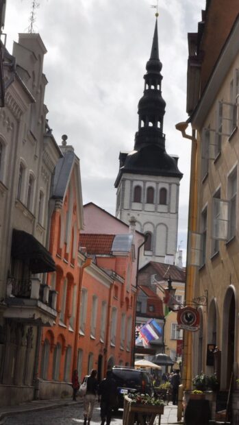 A charming historic street with colorful buildings and a tall church tower in Estonia Wallpapers, HD Mobile Wallpaper