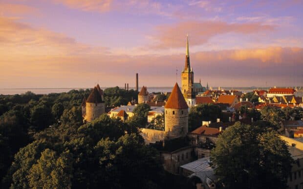 The Estonia wallpapers show old towers and a city skyline with a beautiful sunset sky, HD Desktop Wallpaper