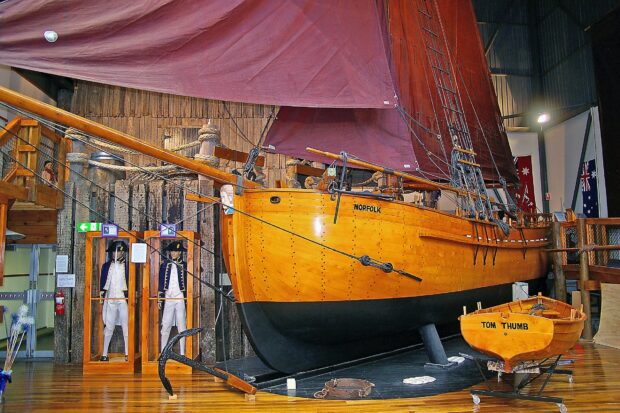 A historic wooden sailing ship named Norfolk is displayed at the Maritime Museum with mannequins in naval uniforms, HD Desktop Wallpaper