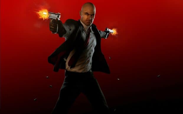 Agent 47 firing guns with bullet casings flying, HD Desktop Wallpaper
