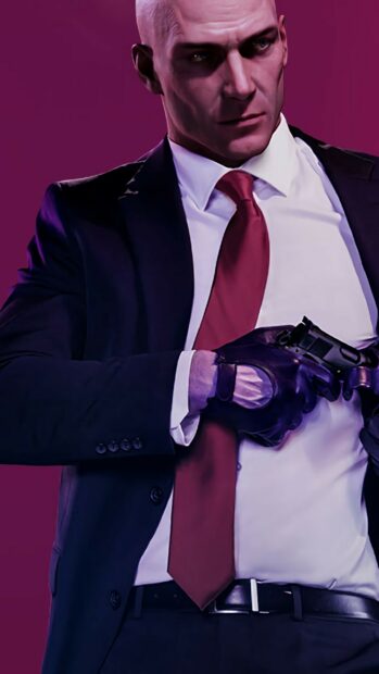 The Hitman game character wearing a suit and red tie is holding a gun with a serious expression, 2K Mobile Wallpaper