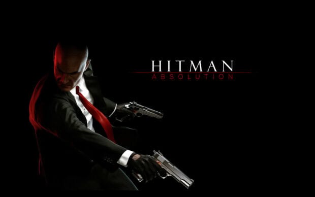 The hitman character aims two pistols in a dark setting, HD Desktop Wallpaper