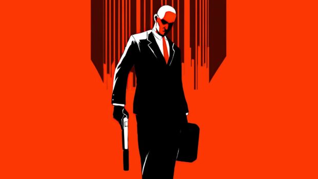 A hitman character in a black suit holds a gun and briefcase against a red backdrop, HD Desktop Wallpaper