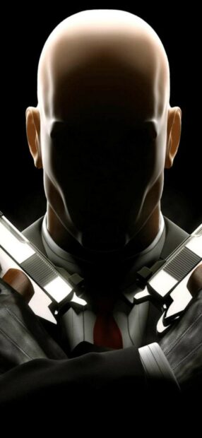 The Hitman game character stands with crossed guns in a dark setting, HD Phone Wallpaper