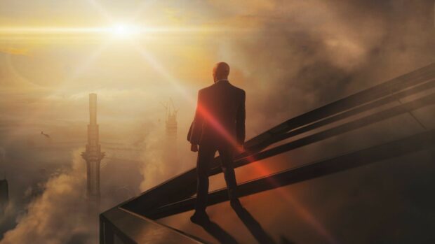 A Hitman game character stands on a rooftop overlooking a foggy city with the sun setting, HD Desktop Wallpaper