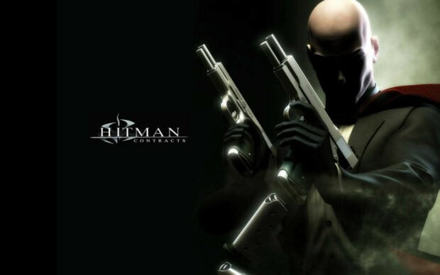 A bald man holds two pistols ready in a smoky atmosphere from Hitman Game Wallpapers 4K, HD Desktop Wallpaper