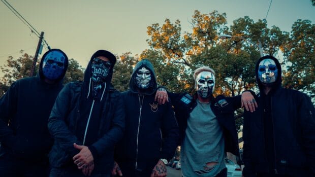 The Hollywood Undead band members wear distinctive masks while posing outdoors, HD Desktop Wallpaper