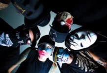 The Hollywood Undead band members wear distinctive masks and dark clothes in a group photo, HD Desktop Wallpaper