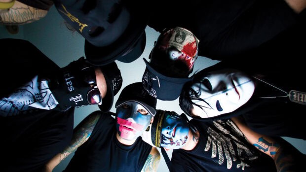 The Hollywood Undead band members wear distinctive masks and dark clothes in a group photo, HD Desktop Wallpaper