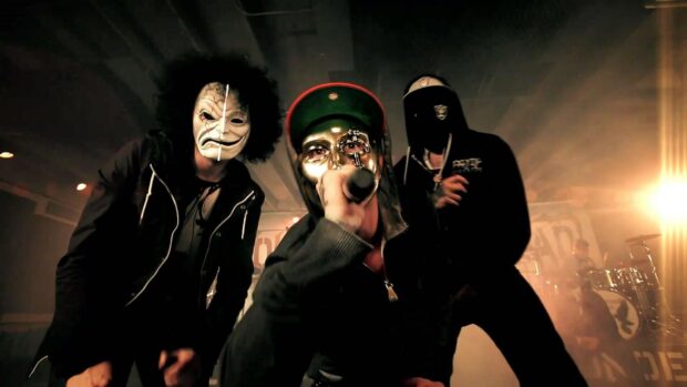 The Hollywood Undead band members wear masks during energetic concert, HD Desktop Wallpaper