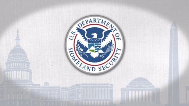 The Homeland Wallpapers emblem is centered over a faded cityscape background, HD Desktop Wallpaper