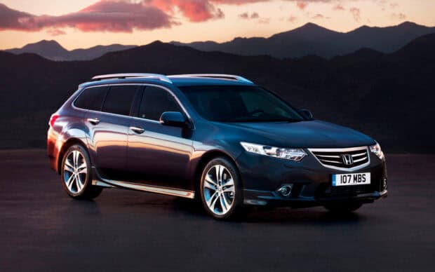 A sleek Honda Accord stands on a road with mountains and a colorful sunset sky in the background, HD Desktop Wallpaper