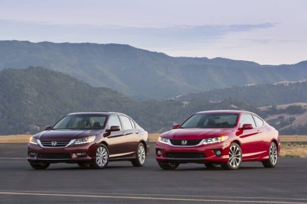 Two red Honda Accord cars are parked on a road with mountains in the background, 2K Desktop Wallpaper