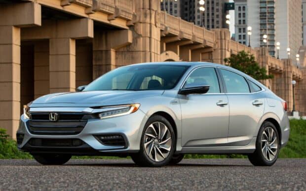 A silver Honda Insight parked near modern bridge architecture, HD Desktop Wallpaper