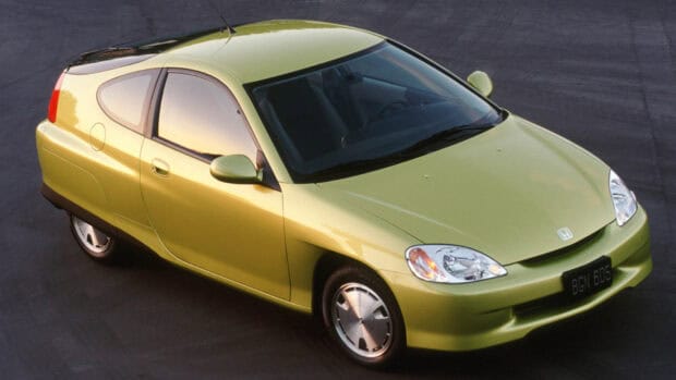 A green Honda Insight hybrid car is parked on asphalt, showcasing its aerodynamic design, HD Desktop Wallpaper