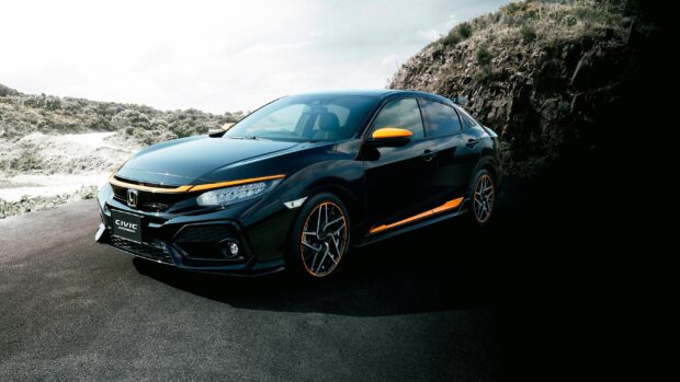 A black Honda Insight car with orange highlights is parked near rocky terrain, 2K Desktop Wallpaper