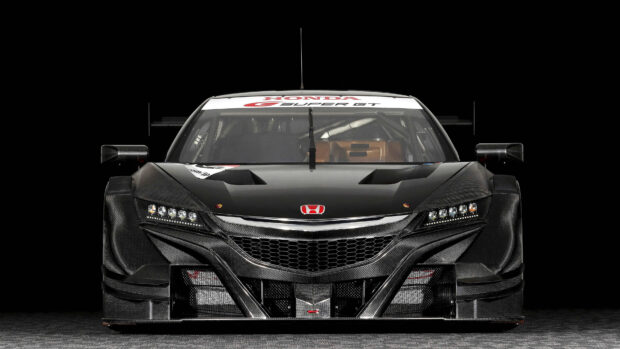 A black Honda NSX racing car is shown from the front with detailed carbon fiber design, 4K Desktop Wallpaper